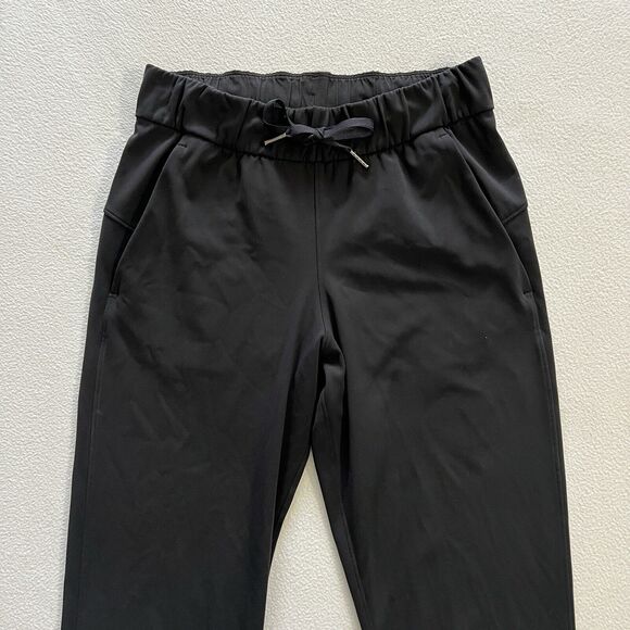 Lululemon Women Solid Black On the Fly 7/8 Drawstring Luxtreme Travel Pant 2 - Picture 2 of 7